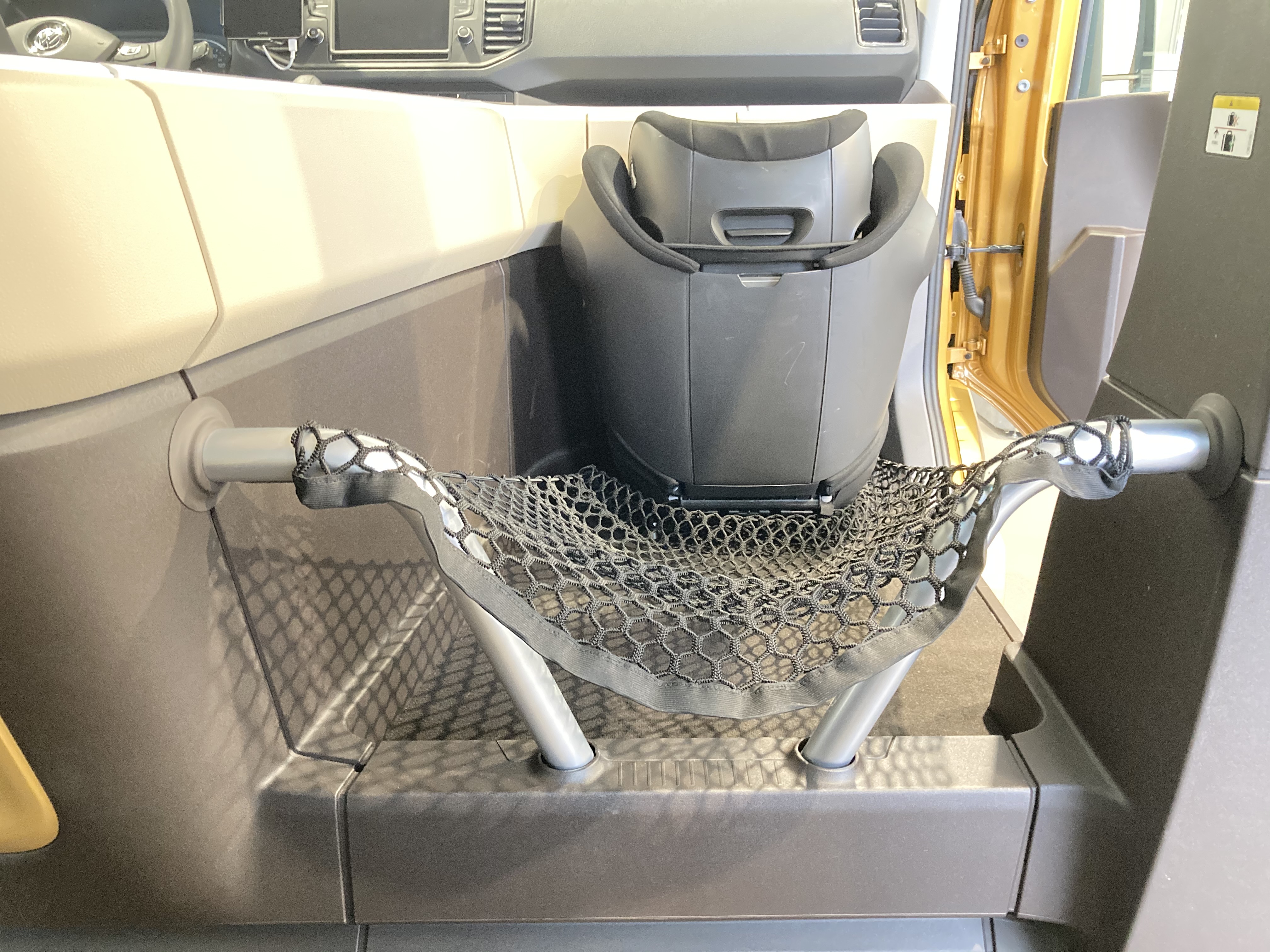 The picture shows the empty luggage compartment of a MOIA