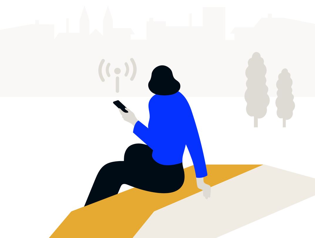 Eine Frau mit einem Handy in ihrer Hand